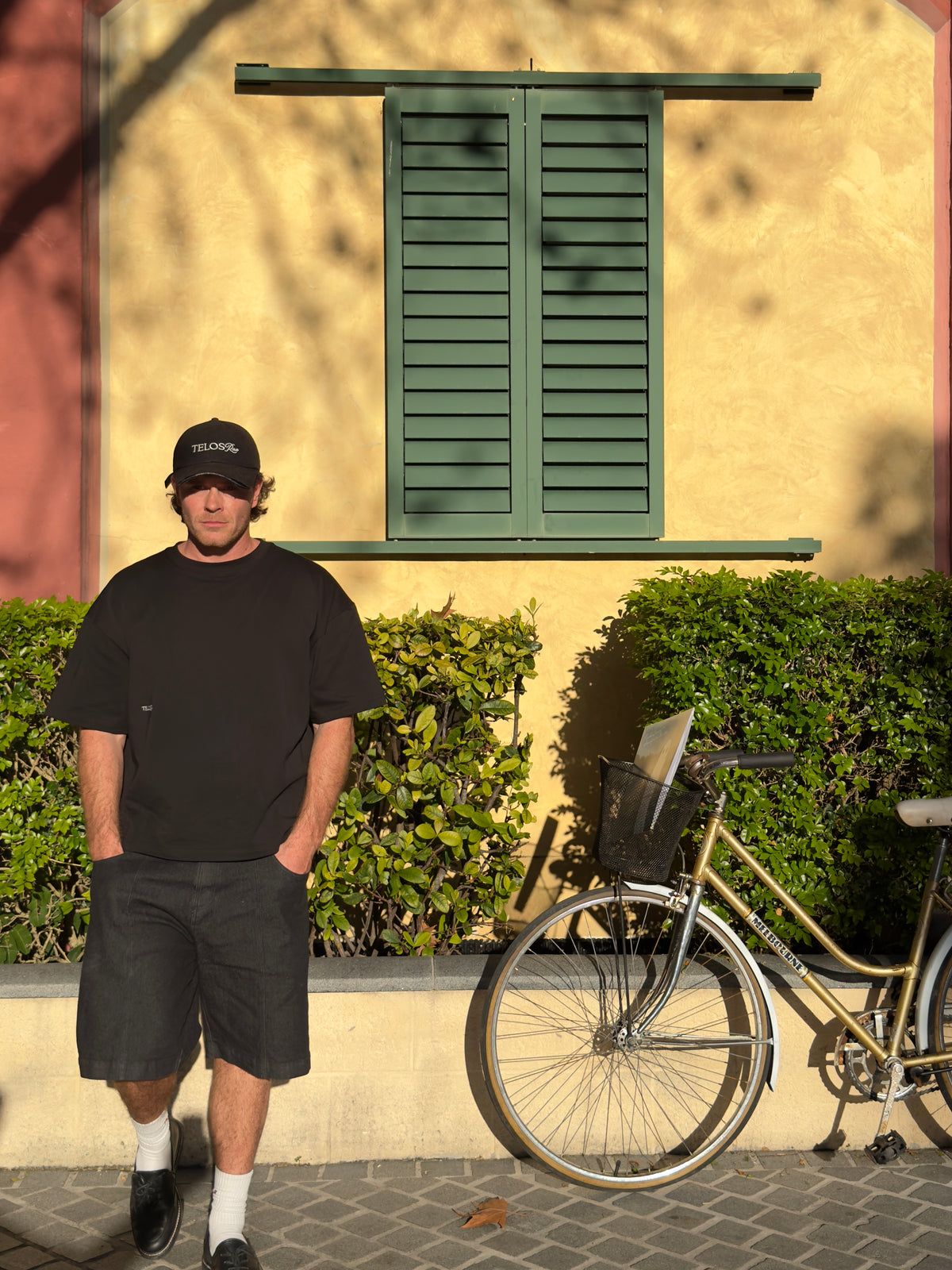 Telos Rae Box Tee in black worn on location