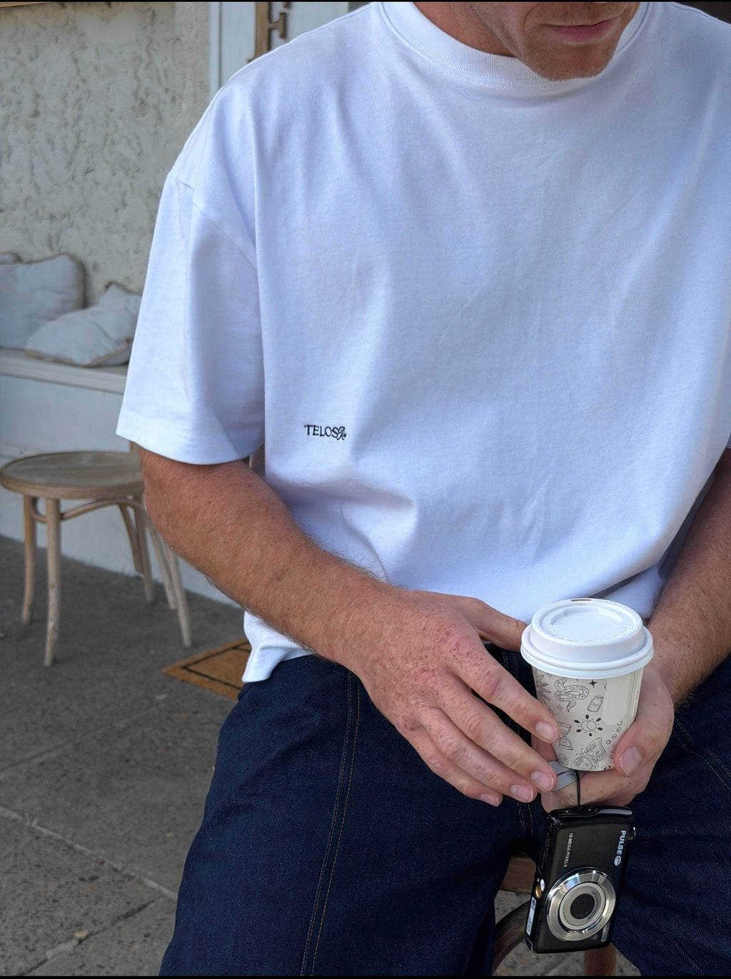 Telos Rae Box Tee in white worn on location