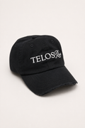 Telos Rae Dad Hat in black with cut brim, angled view