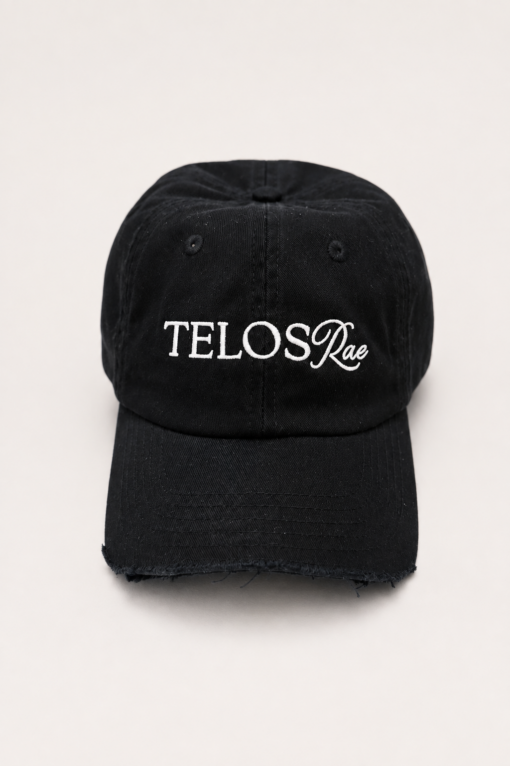 Telos Rae Dad Hat in black with cut brim, front view